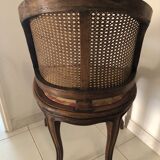 Old wooden armchair and cannage