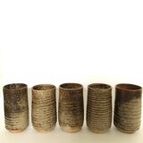 Series of five cups in sandstone