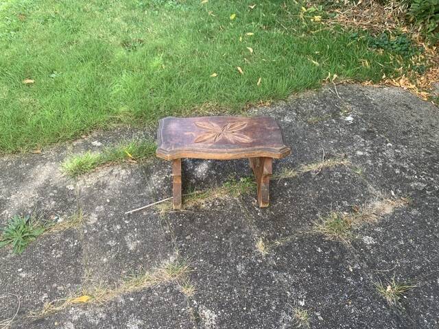 Bench in carved and varnished wood, mountain chalet decoration, old