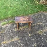 Bench in carved and varnished wood, mountain chalet decoration, old