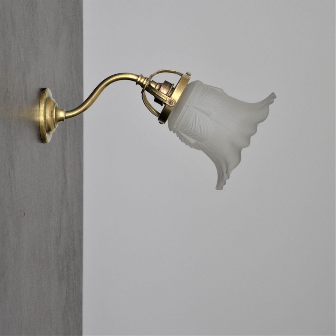 Brass gooseneck wall lamp and tulip lampshade