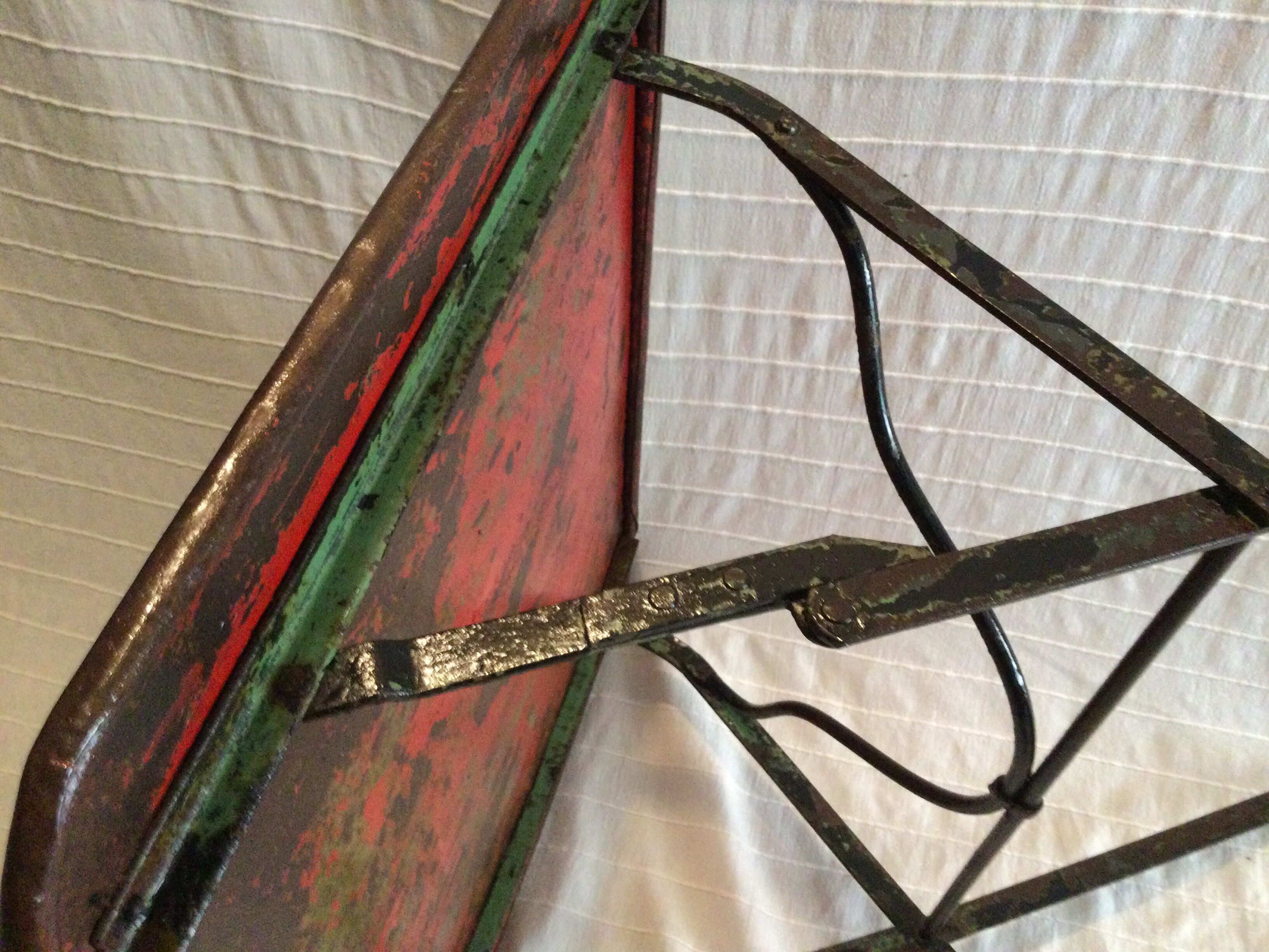 Folding riveted iron table