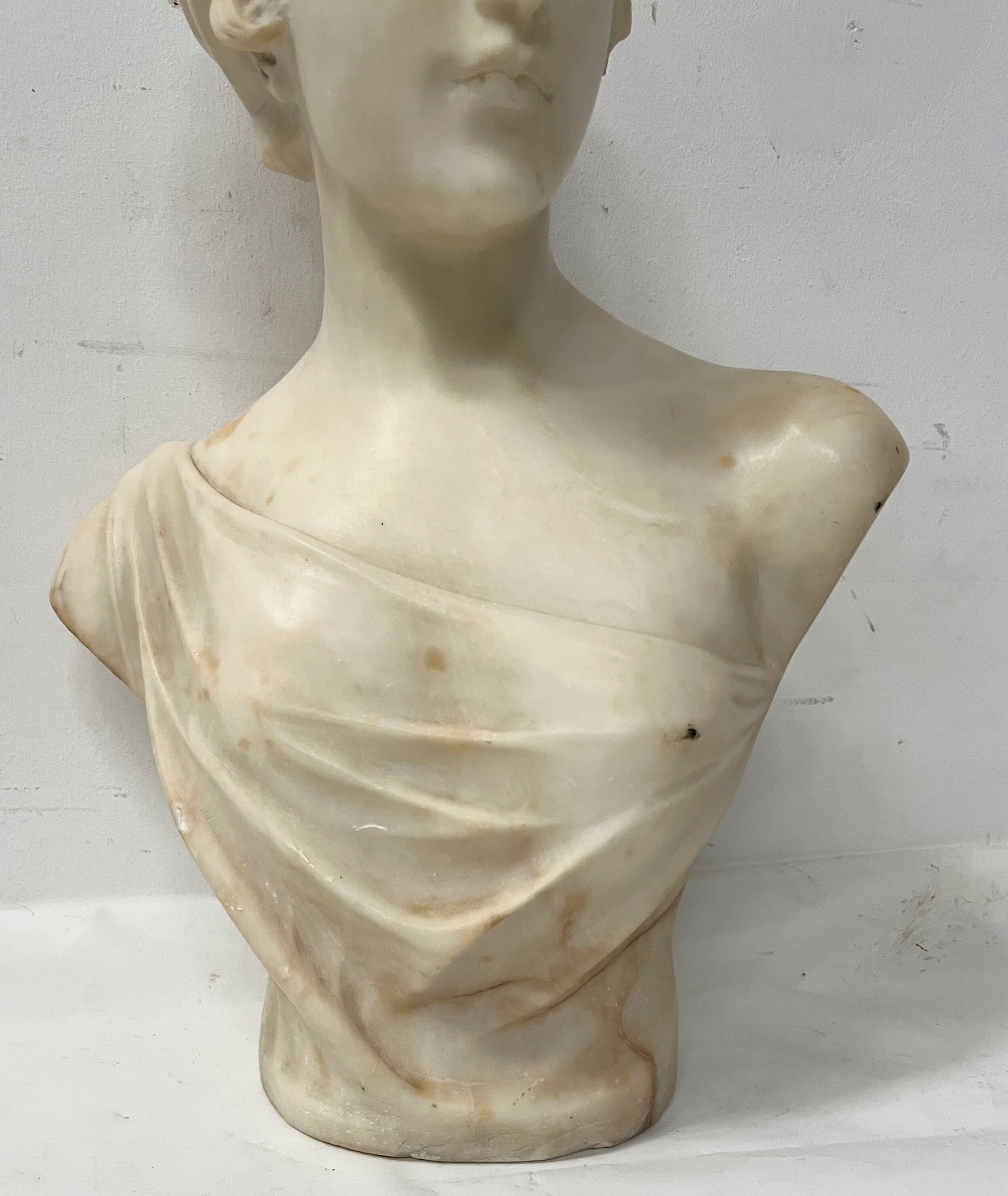 Sculpted marble group of a young woman's bust, 20th century.