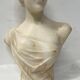 Sculpted marble group of a young woman's bust, 20th century.
