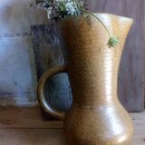 Vintage pitcher with enamelled earth cove