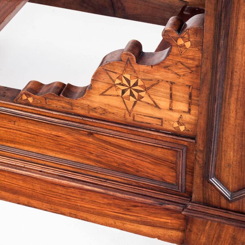 Bed made of solid walnut with marquetry details. France, 1930s.