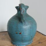 Sandstone pitcher painted in turquoise, very old pottery