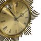 Horloge vintage sunburst de couleur dorée, design Junghans des années 1970