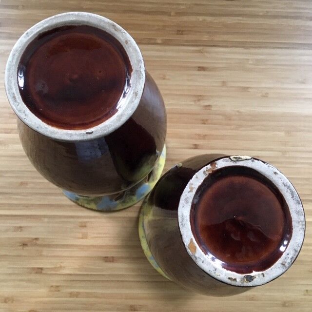 Pair of flaming ceramic vases