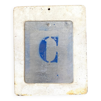 Letter C on metal plates