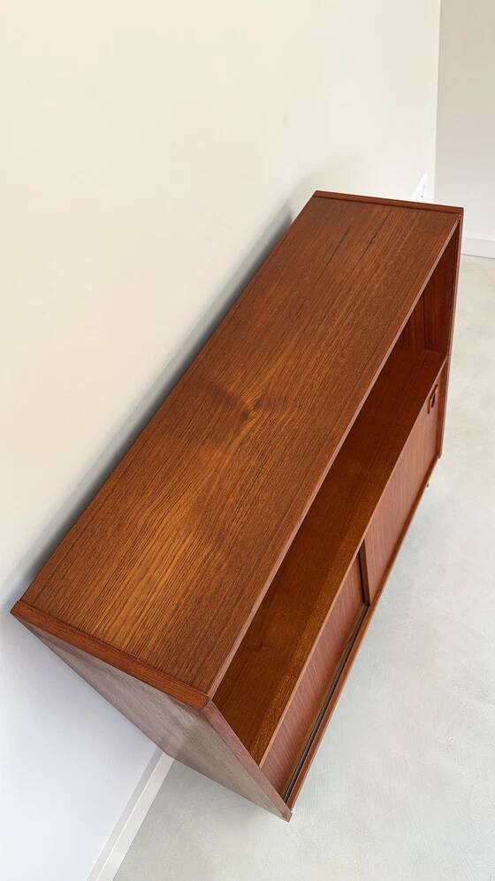 Vintage wooden cabinet with sliding doors