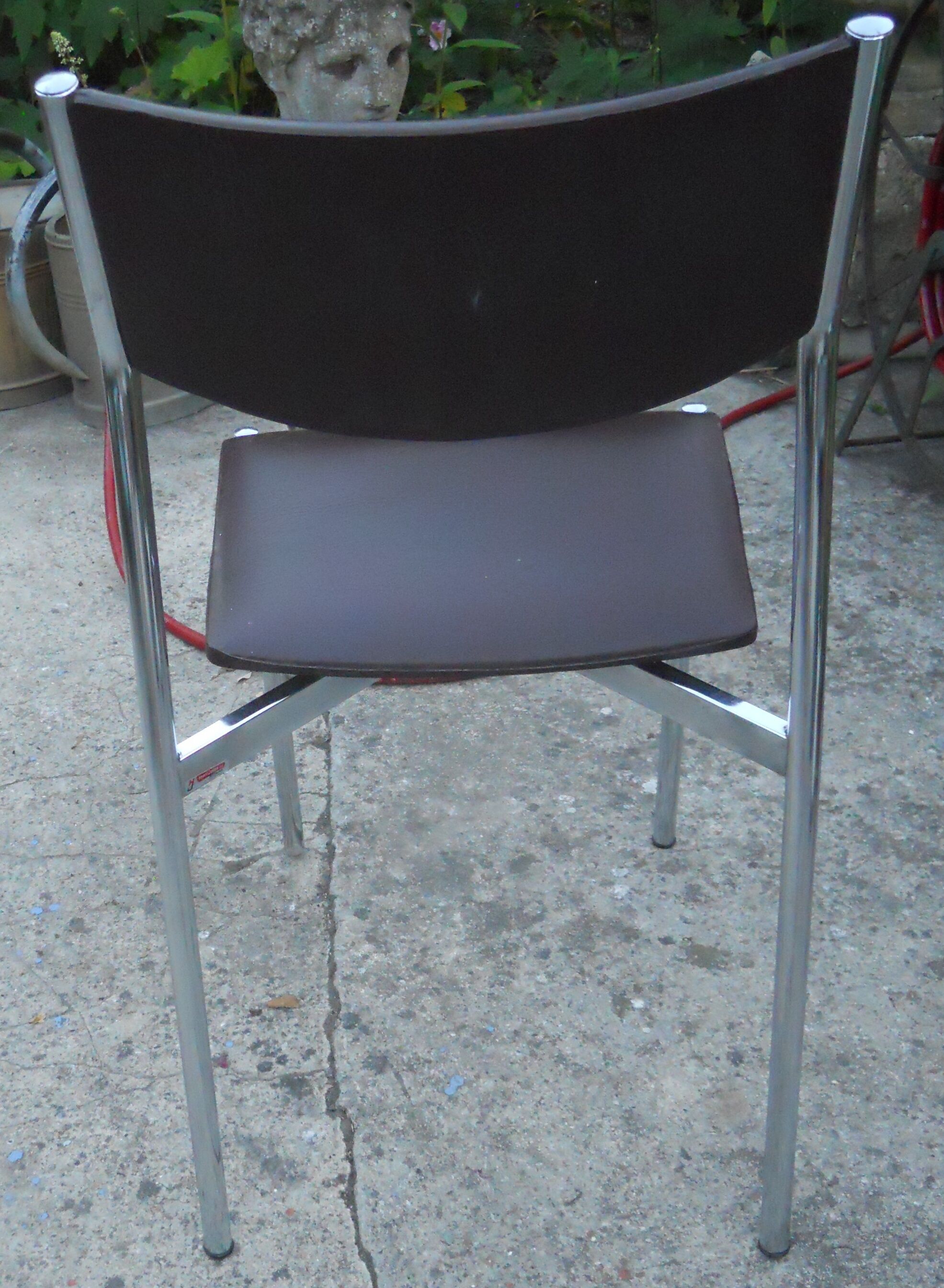 Vintage chrome metal chair and faux black leather