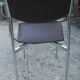 Vintage chrome metal chair and faux black leather