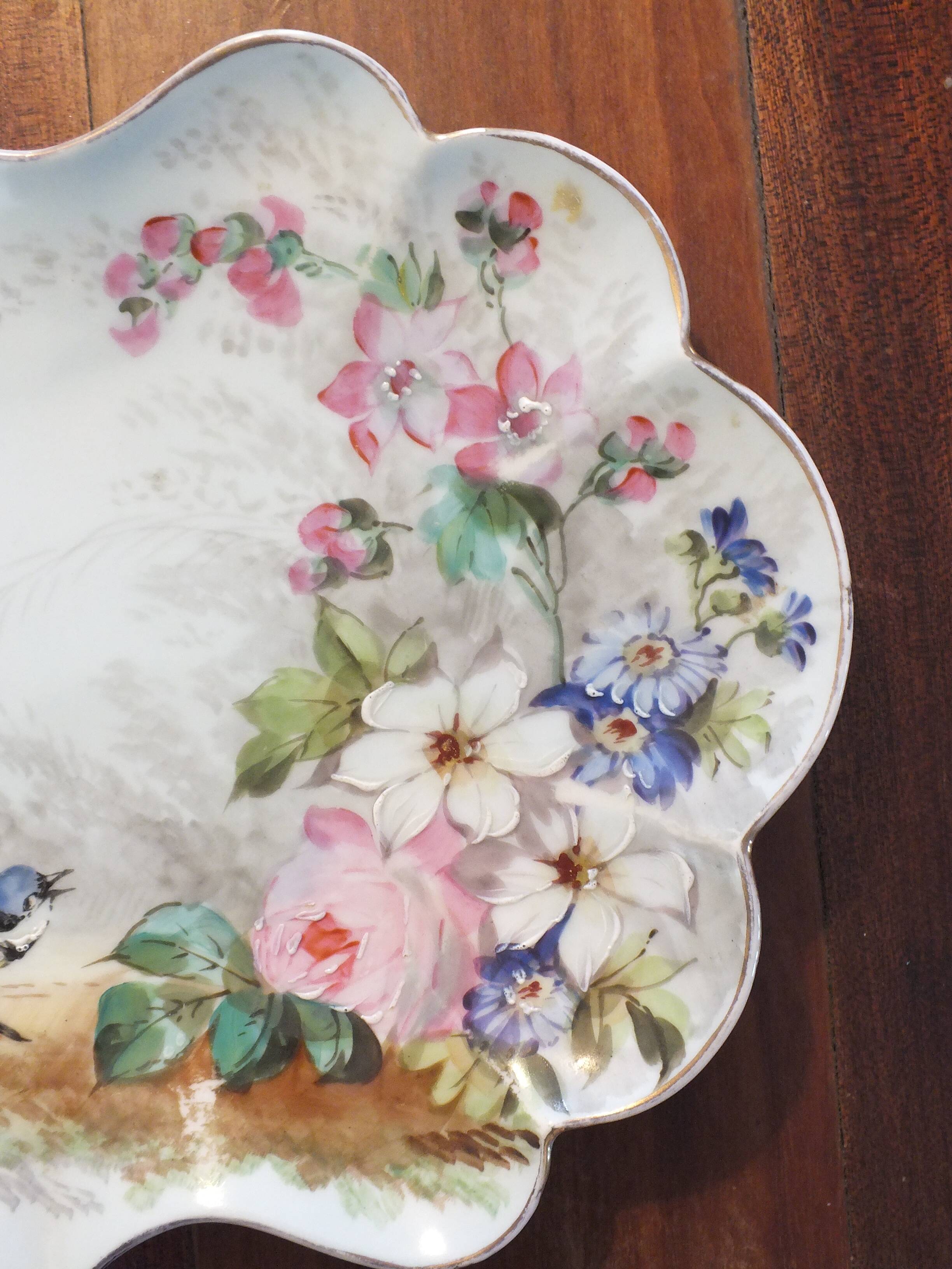 Pair of small porcelain dishes painted with birds and flowers 19th