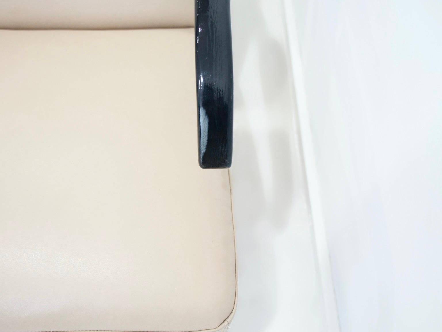 Pair of beige leather and tubular steel armchairs.