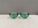 Un ensemble de porte-bougies iittala en verre transparent vert.