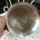 Silver metal ice bucket with its lion's pate tongs