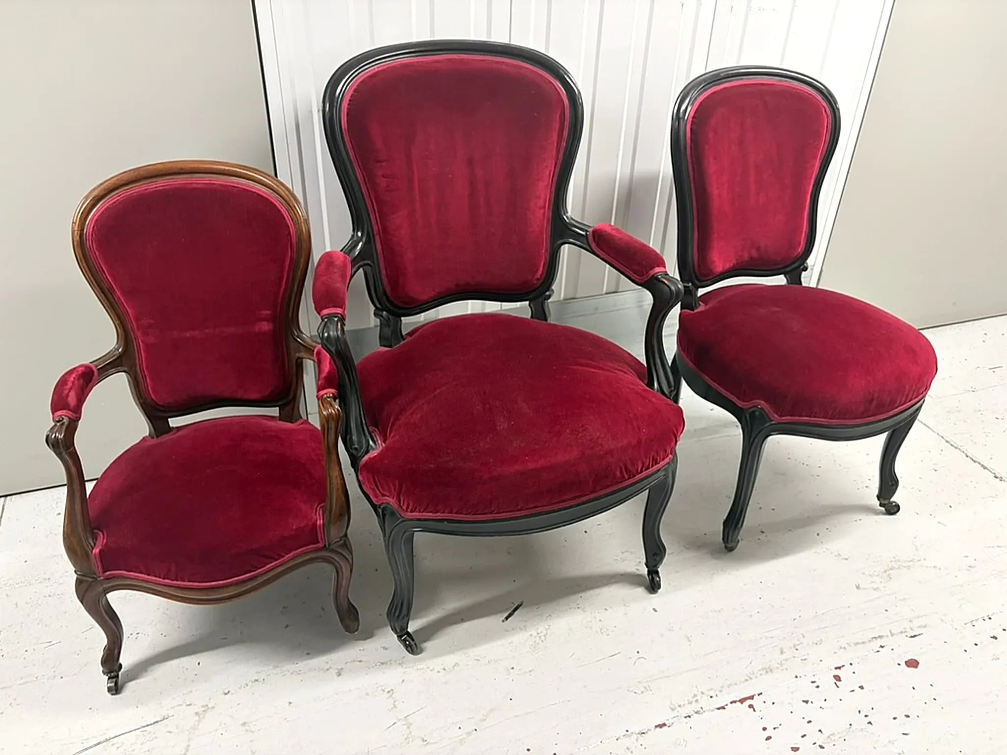 Two armchairs and a Louis-Philippe chair, red velvet.