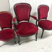 Two armchairs and a Louis-Philippe chair, red velvet.