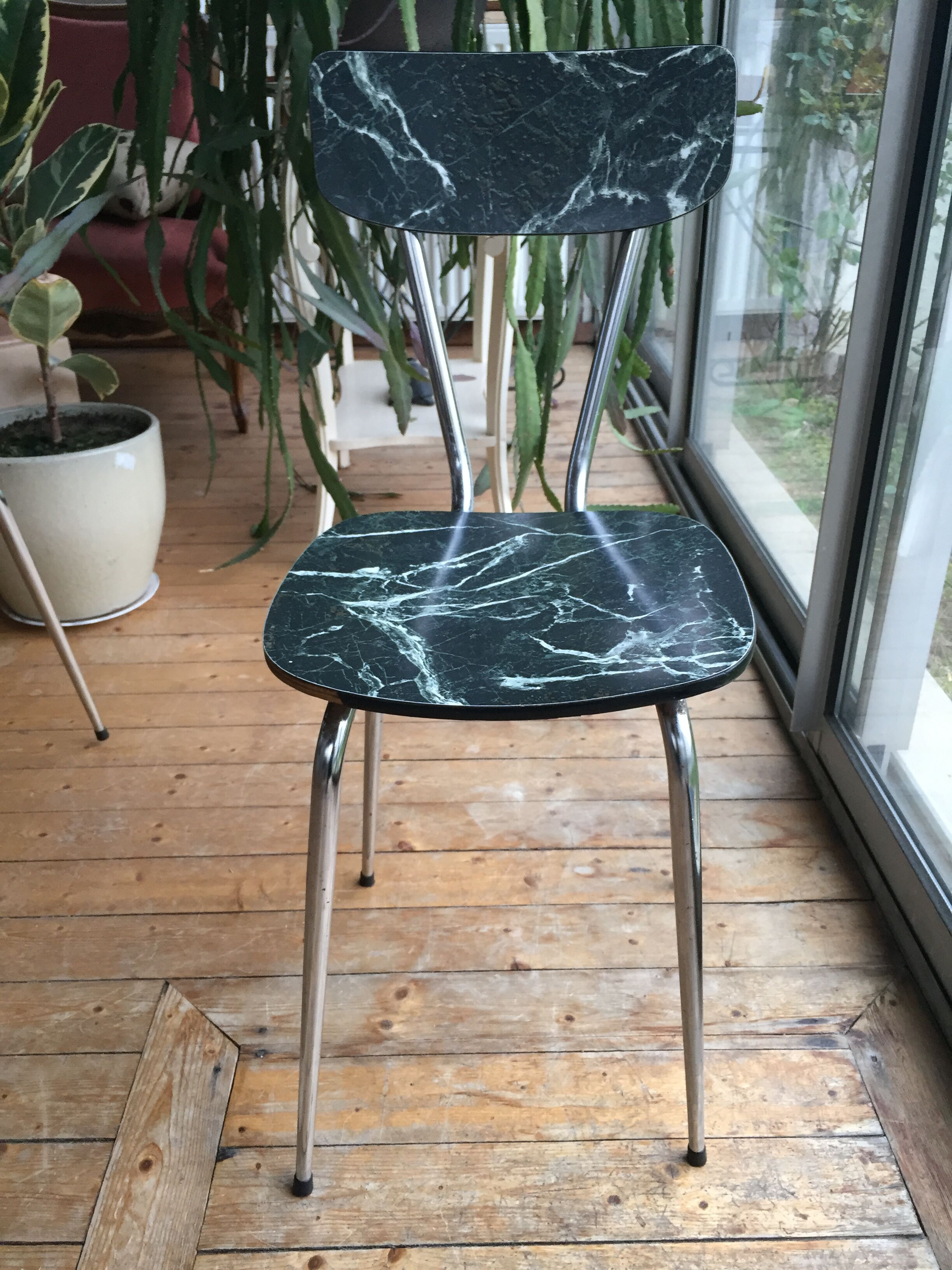 4 chairs in very dark green formica marble effect