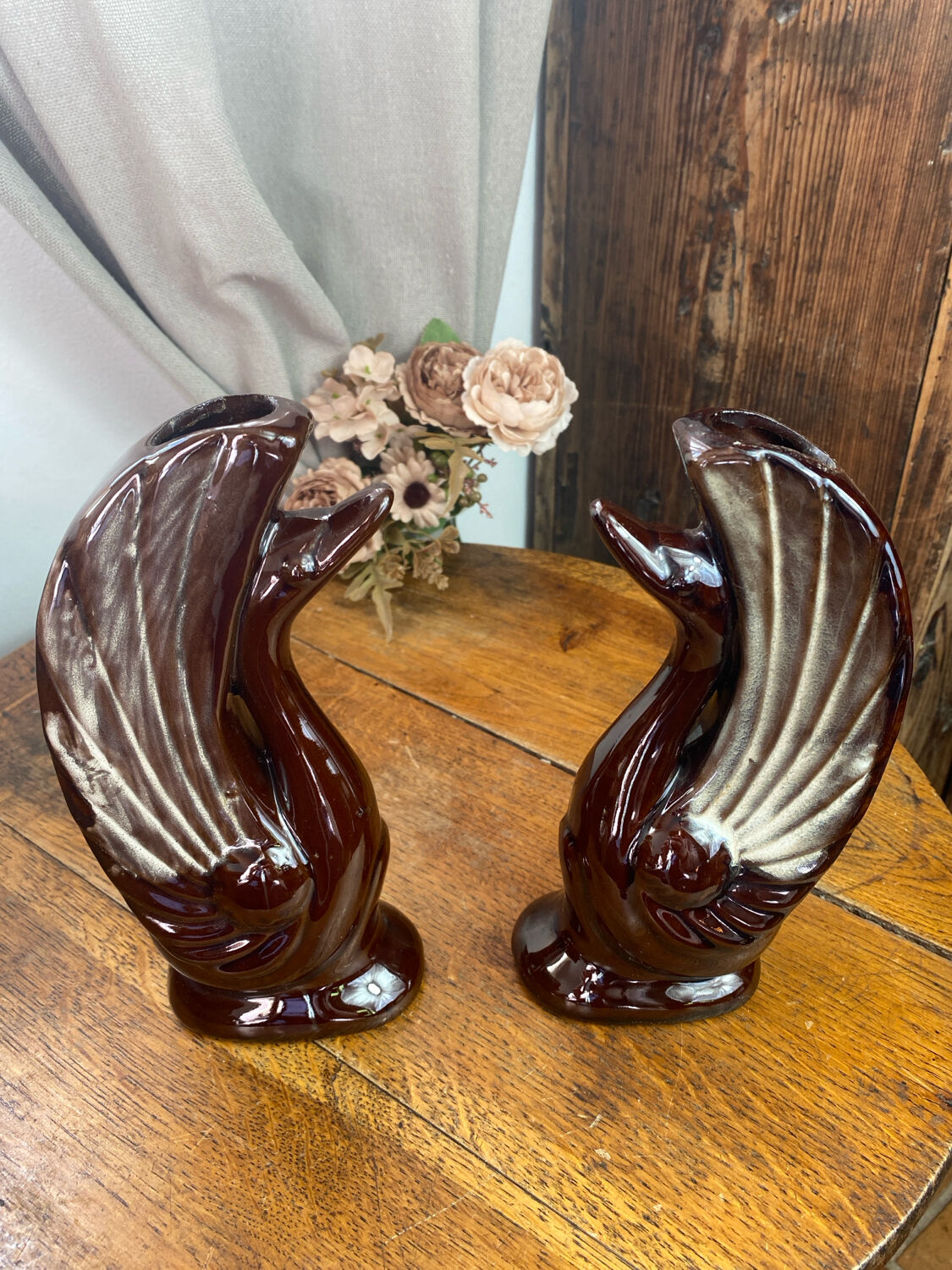 Pair of ceramic vases in the shape of swans.