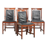 4 chaises de salle à manger Art Déco en cuir de vache noir et en bois.