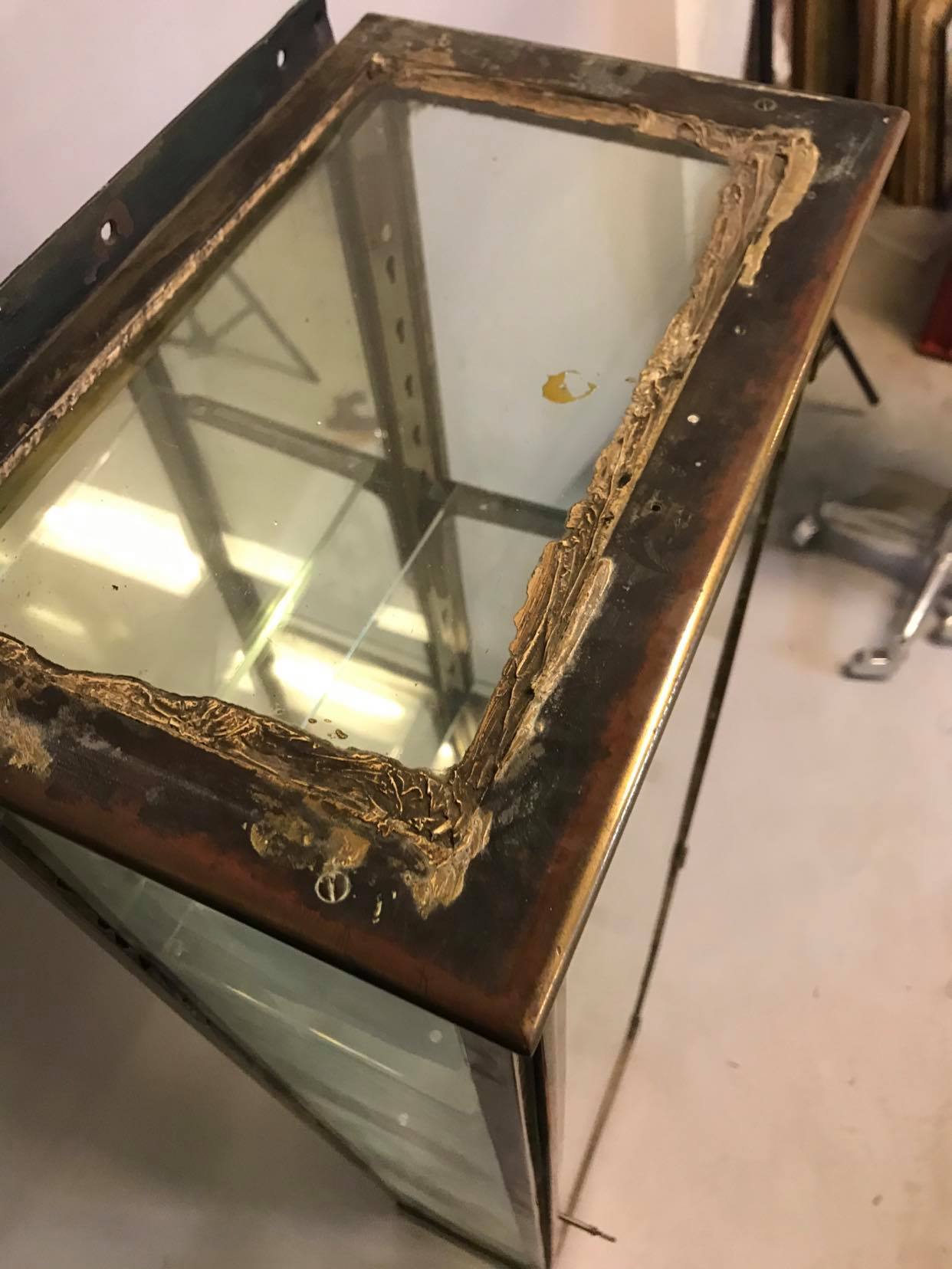 Old brass and mirror showcase