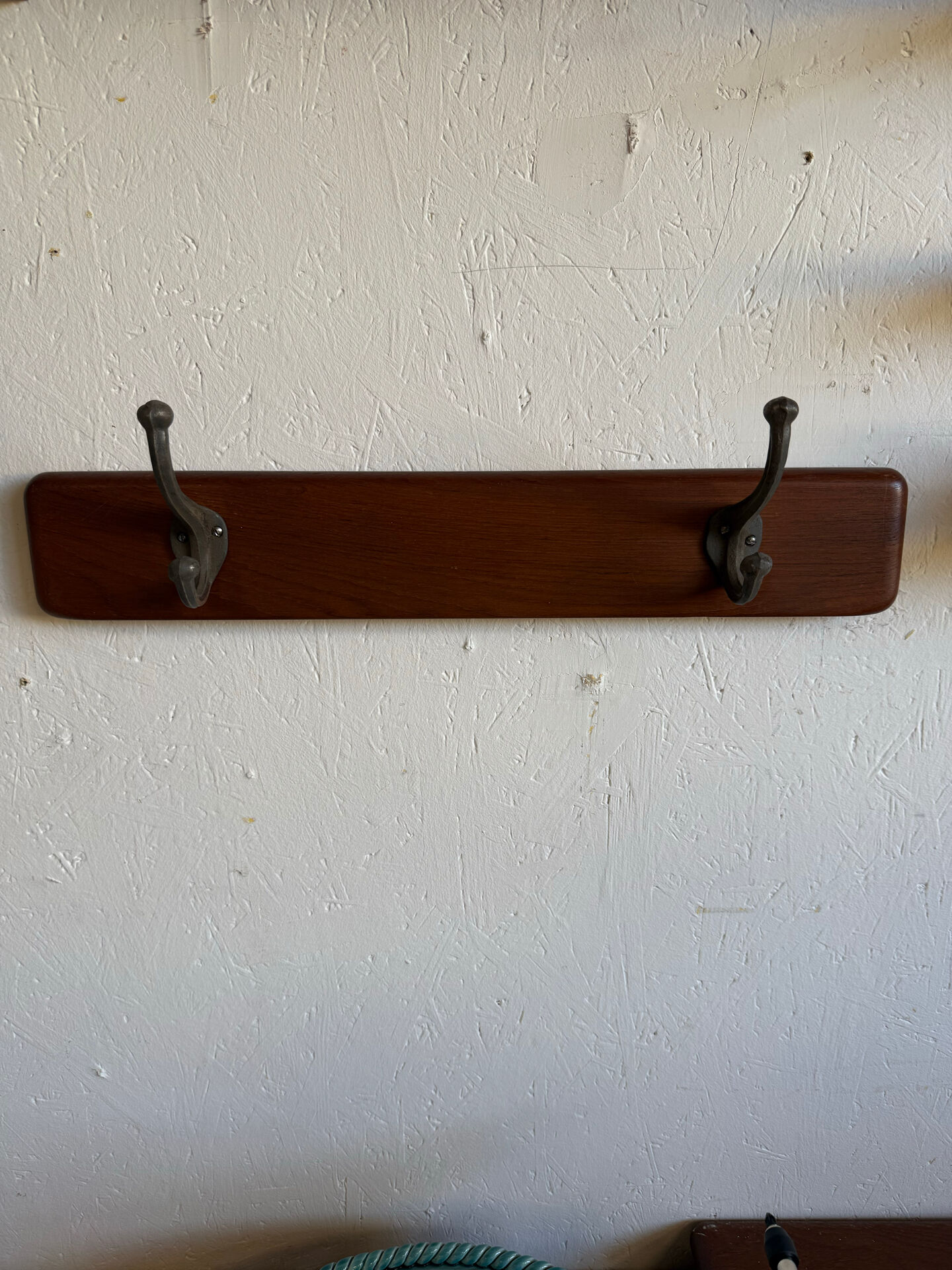 Scandinavian coat rack in solid teak from the 1970s.