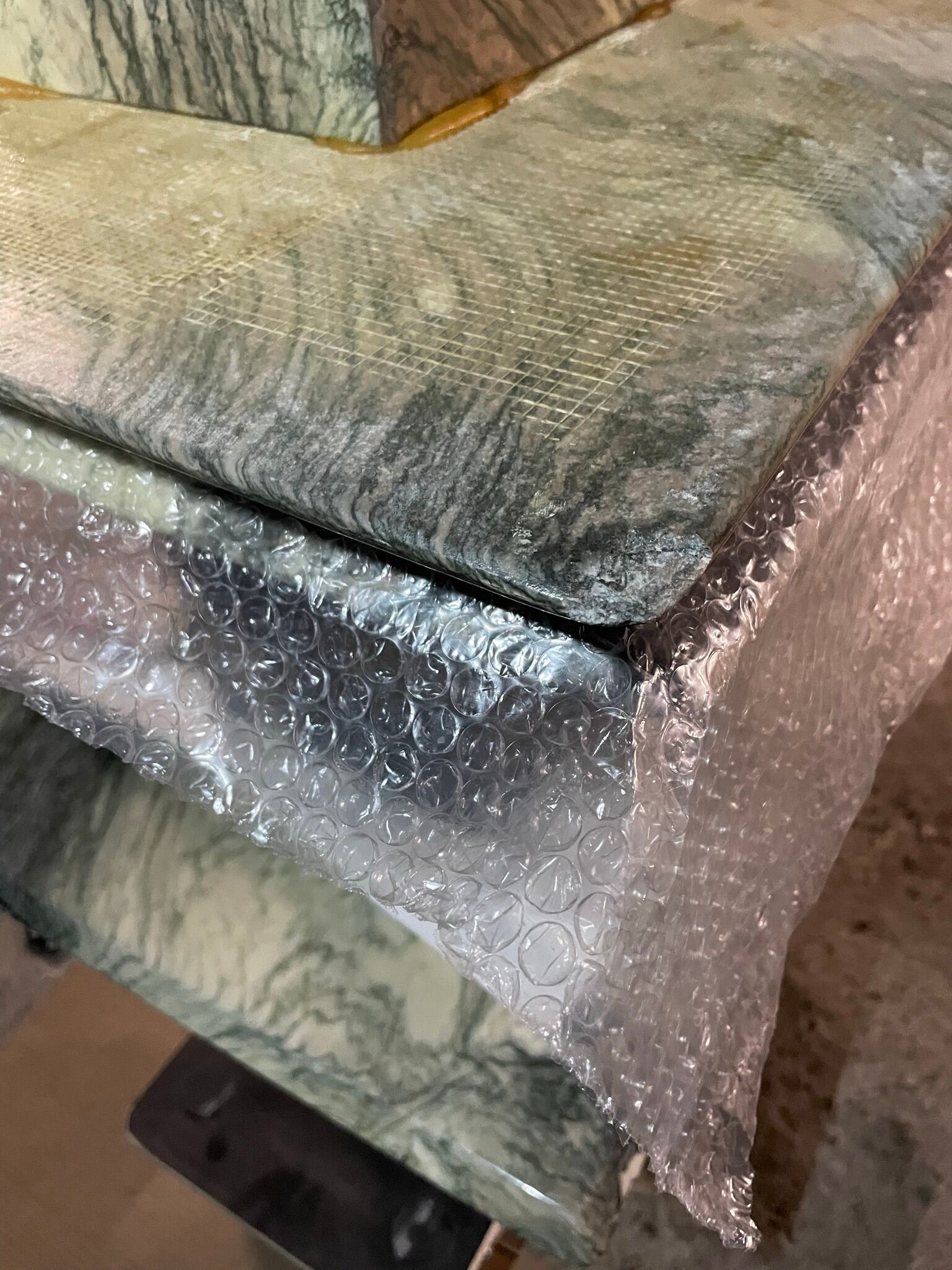 Series of three nesting tables in green marble, 1970