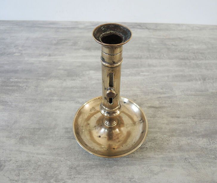 Old metal push candle holder