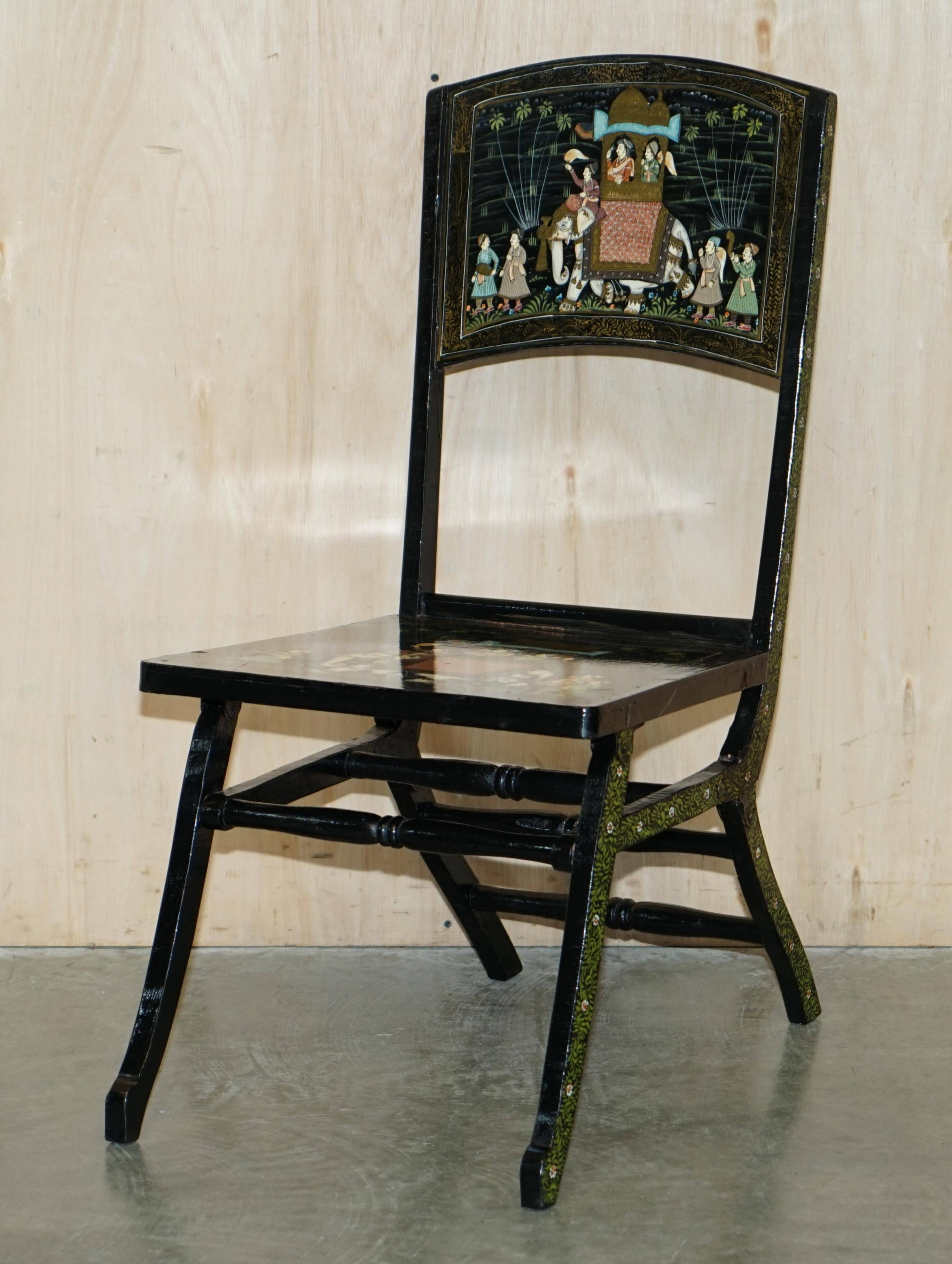 Pair of military folding chairs with Indian decoration.