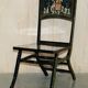 Pair of military folding chairs with Indian decoration.