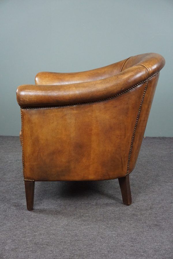 Club chair in patinated sheepskin