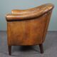 Club chair in patinated sheepskin
