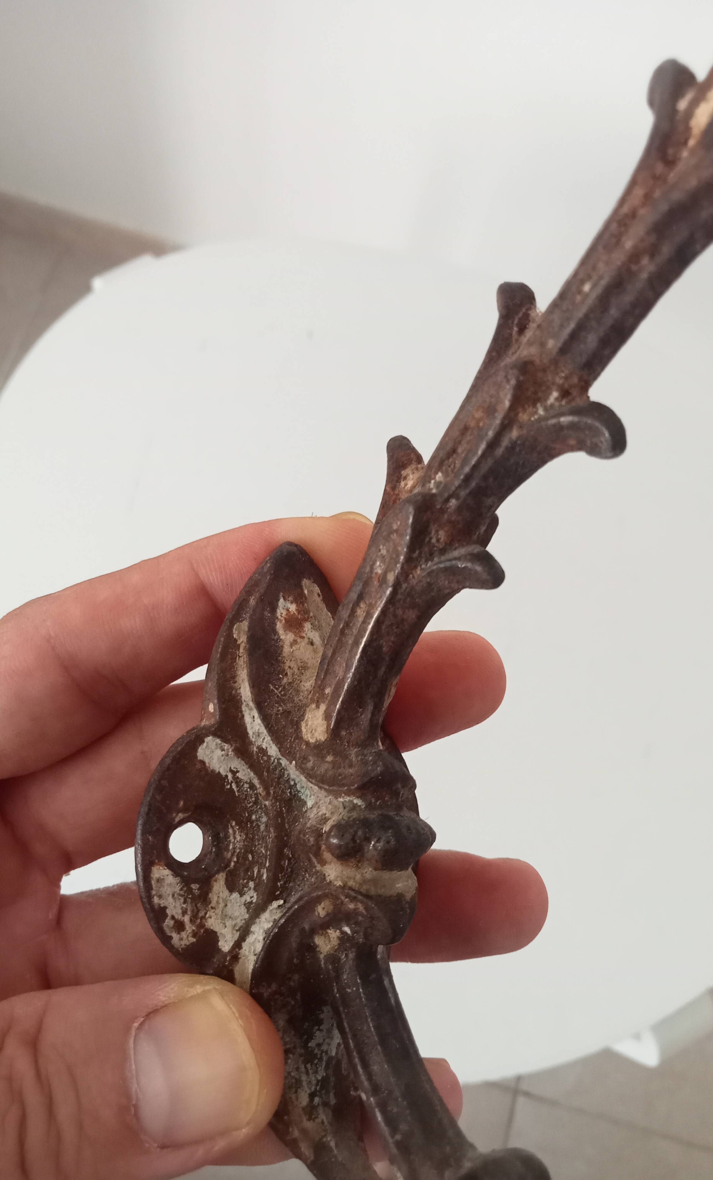 Antique wall coat hook from the 19th century in Victorian cast iron style.