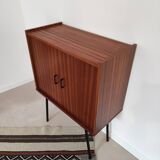 Piece of furniture on high feet metal compass