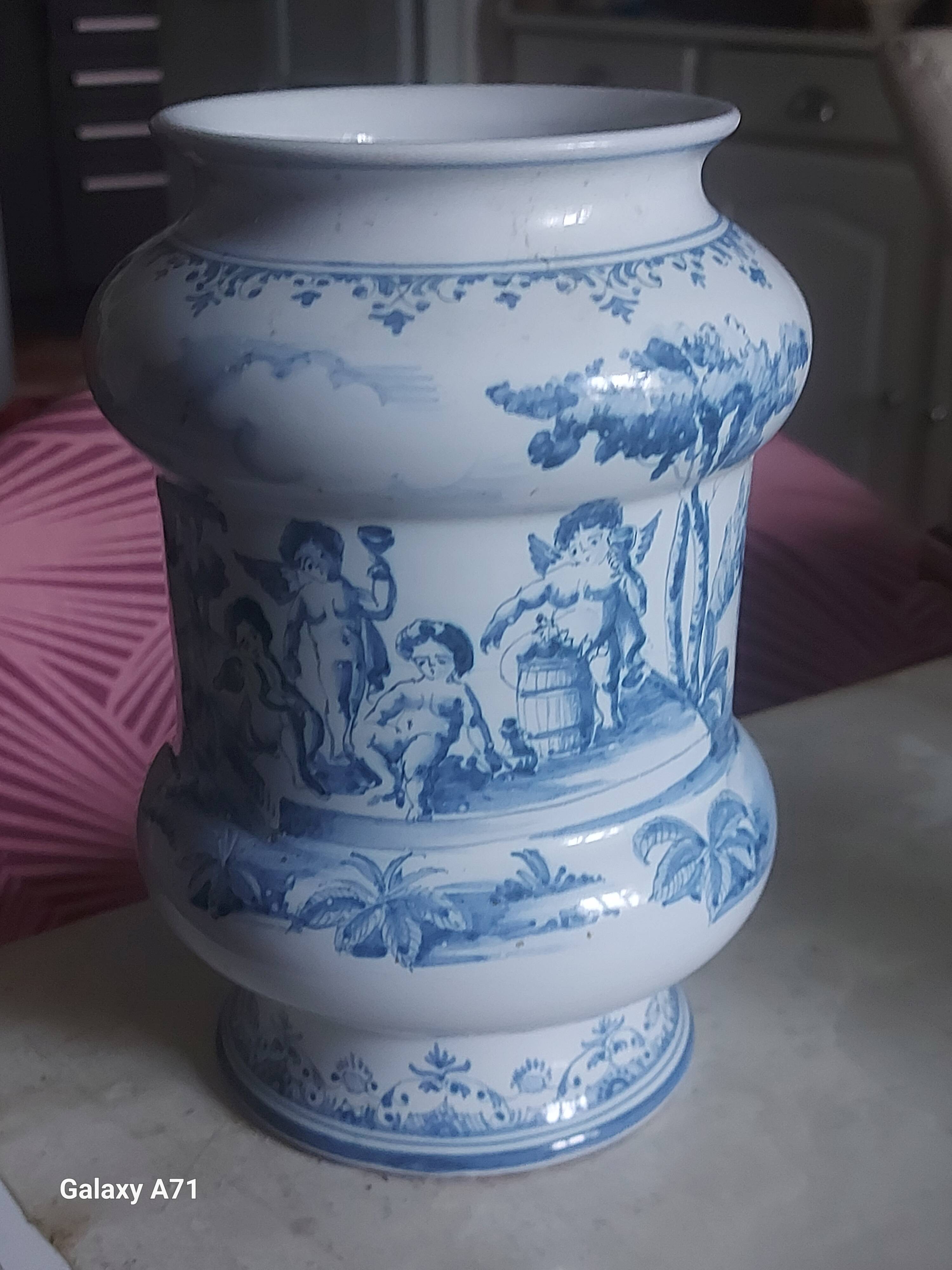 Moustier vase signed