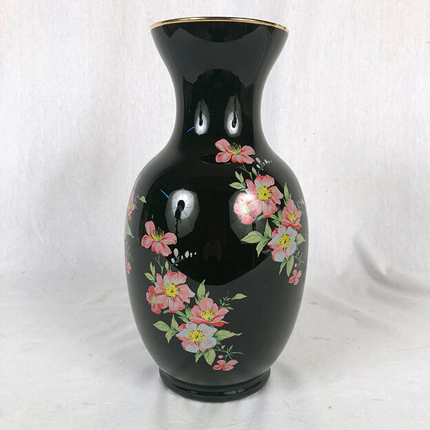 Black opal vase decorated with flowers