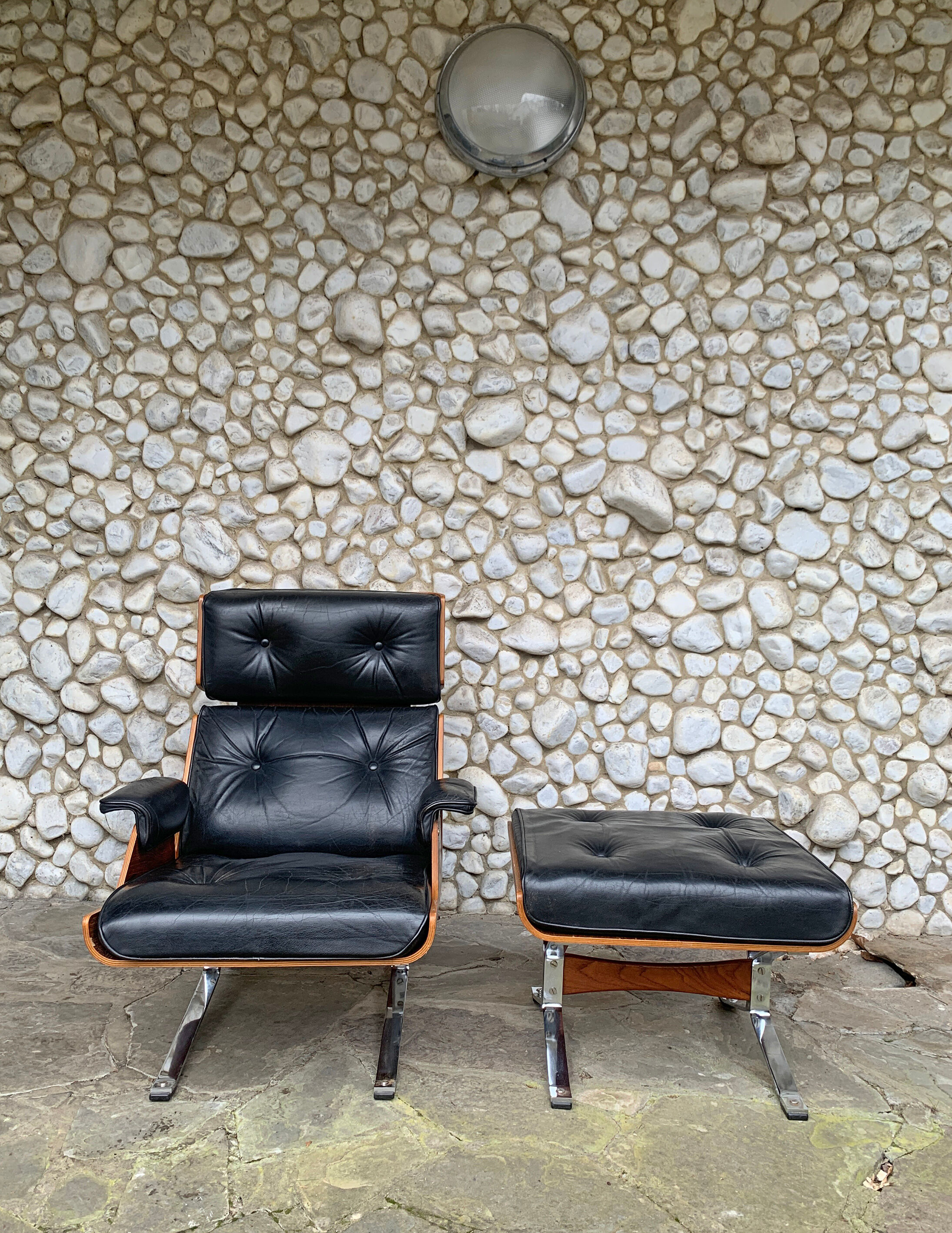 Lounge chair and ottoman black leather and teak multiplex, 1960