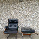 Lounge chair and ottoman black leather and teak multiplex, 1960