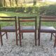 6 chaises vintage scandinave en teck , assises skaï noir en l’état