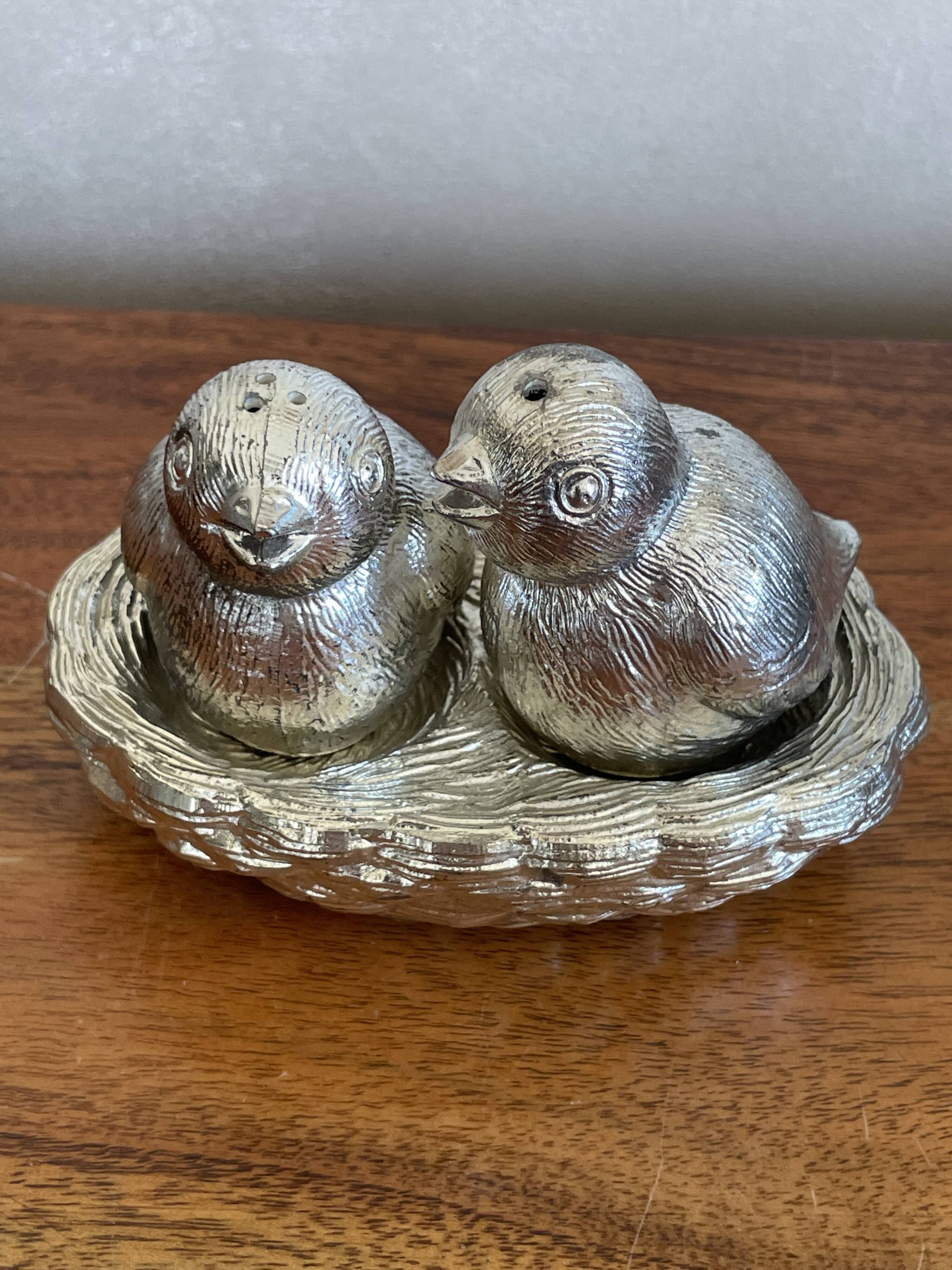 Salt pepper birds in their nest