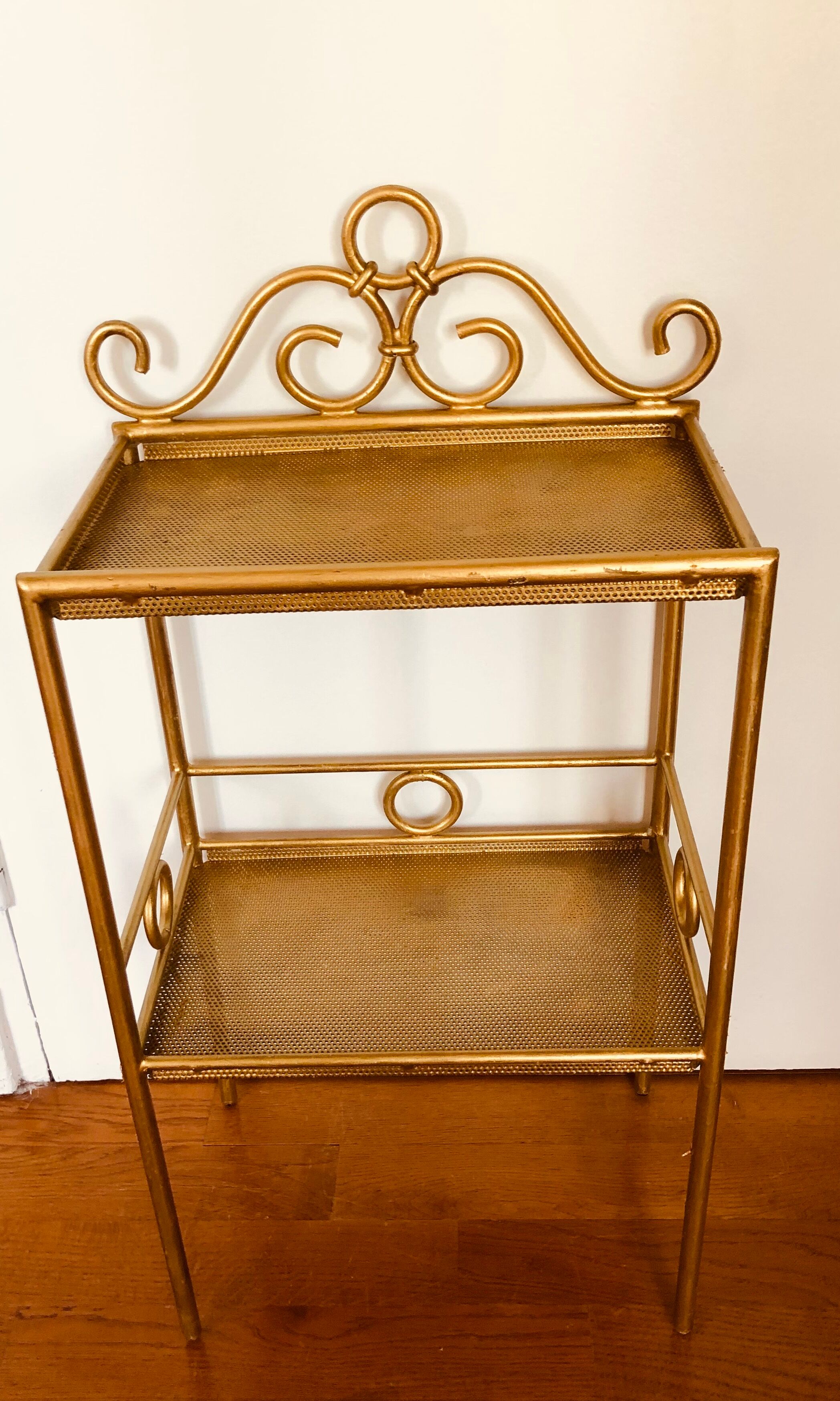 Gold-laquered metal shelf