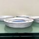 Handmade white ceramic plates with a blue bird in folk art style, set of 4.
