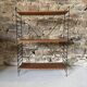 Free-standing shelves in lacquered wood and metal, 1960.