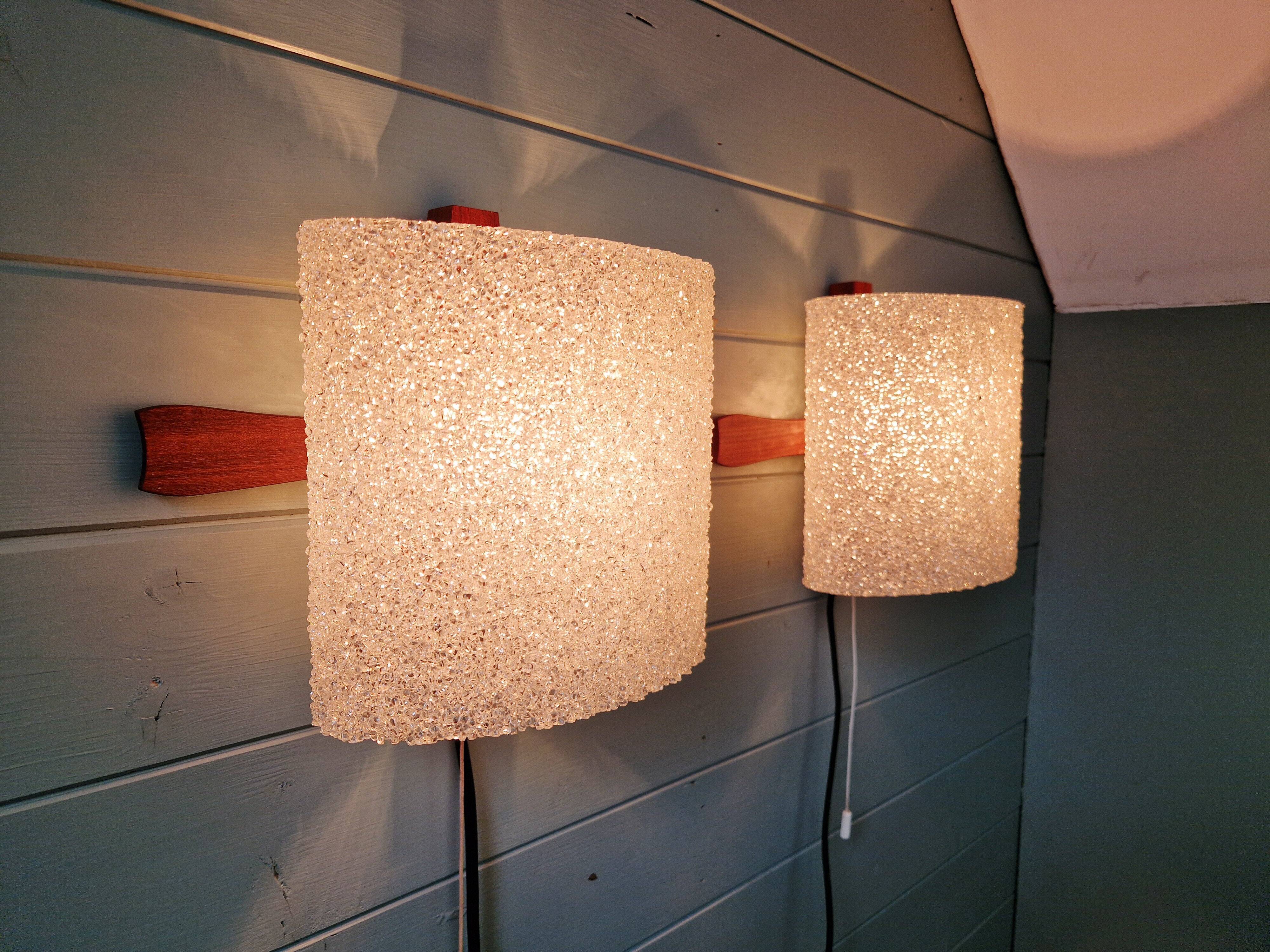 Pair of Scandinavian wall sconces in teak and plastic resin, 1960.