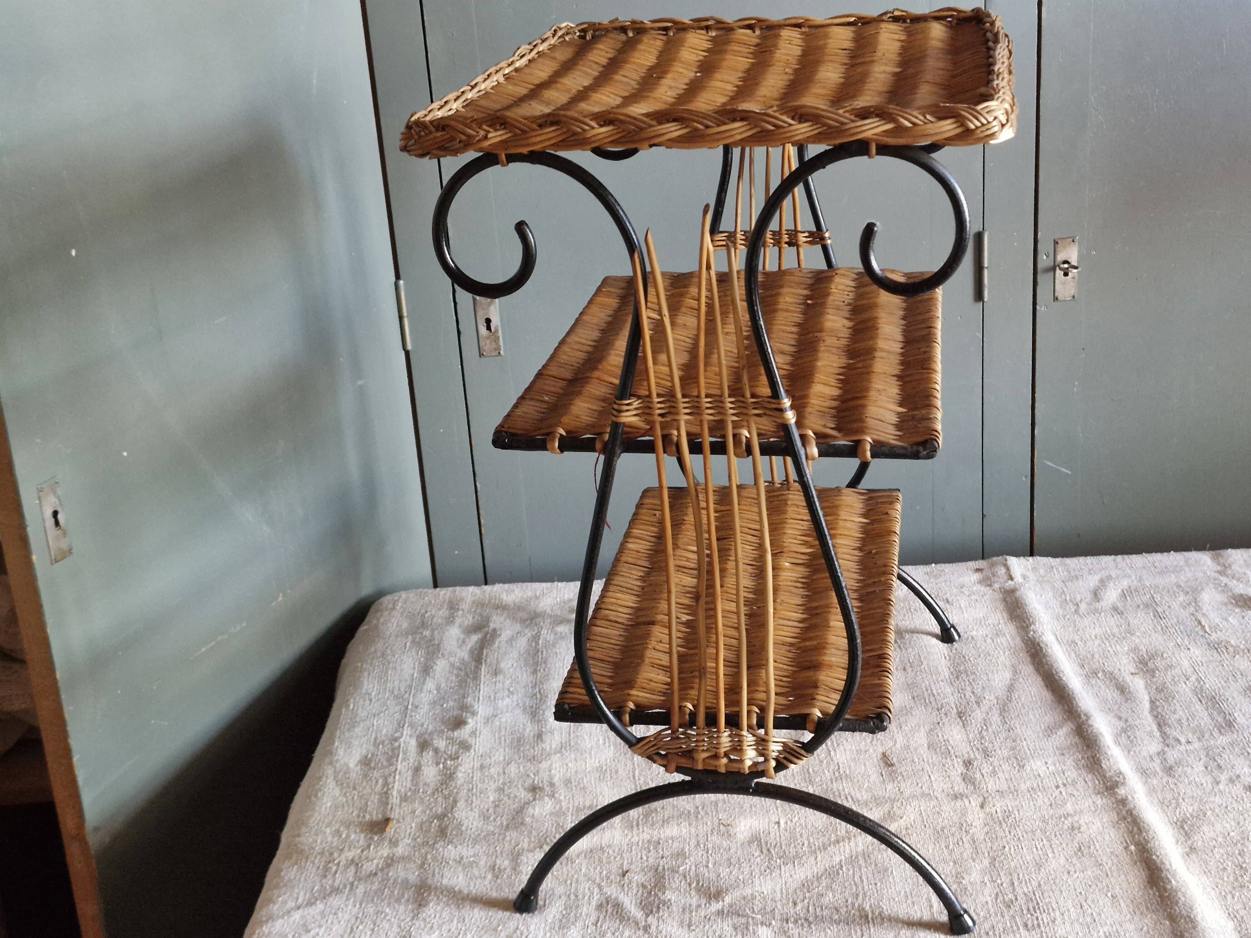 Small antique piece of furniture from the 1960s made of rattan and wrought iron in the shape of a lyre.