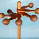 Minimalist organic coat rack in pine from the 1970s in space age style.