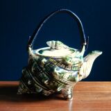 Individual teapot in the shape of a ceramic shell