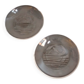 Hermès paire d'assiettes en verre à motif de dauphins